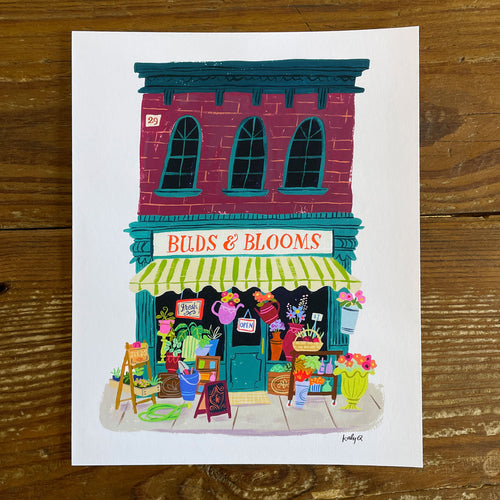Illustration of a vintage flower shop storefront with colorful window displays & flowers, hand lettering reads Buds and Blooms