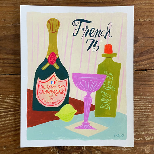 Illustration of a French 75 cocktail in a pink coupe glass with champagne and gin bottles, brush hand lettering reads French 75