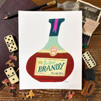 Hand-painted art print of a round vintage brandy bottle with a cream label reading "Excelsior Brandy, Fine Old Stock, 1927" in hand lettered antique style lettering. Styled flat lay on a rustic wooden surface surrounded by dominoes, puzzle pieces, and vintage ephemera.