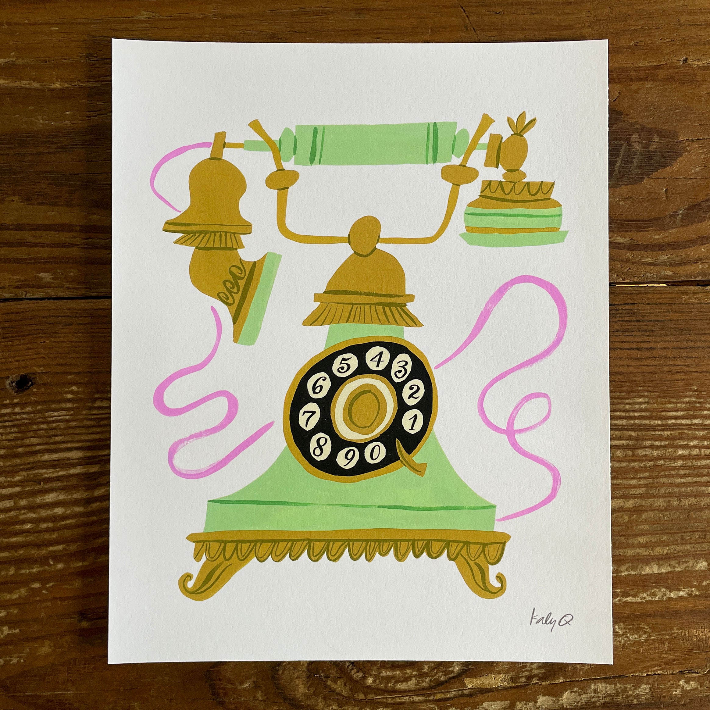 Illustration of a mint green and gold antique rotary telephone with a swirling pink cord
